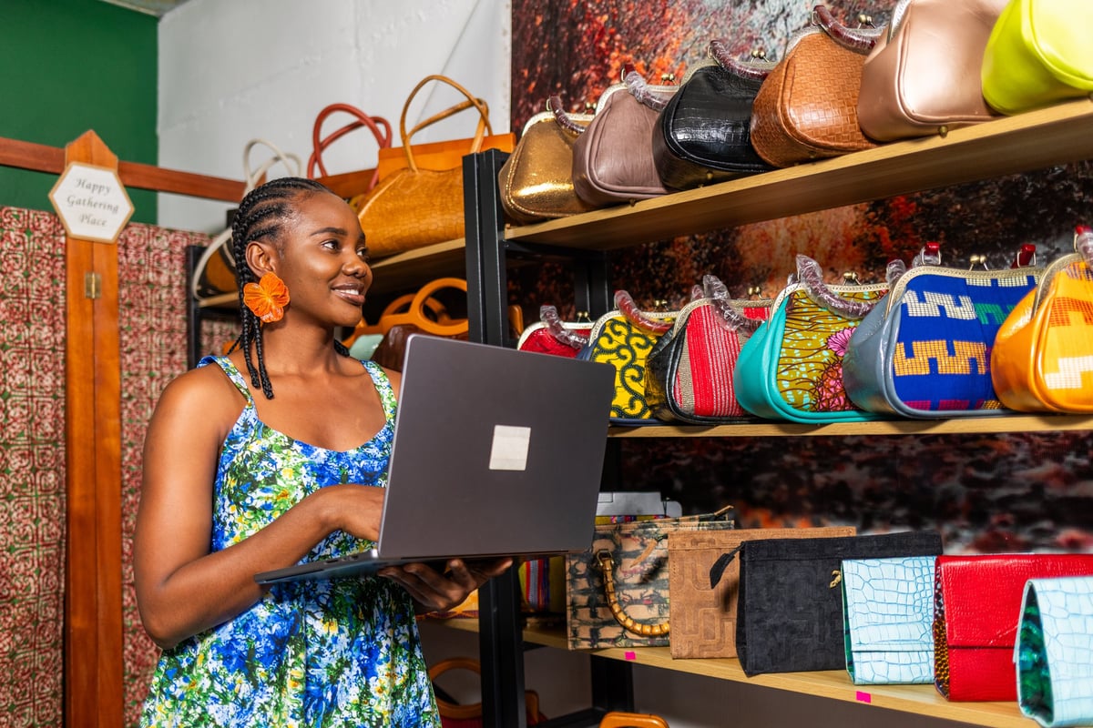Boutique owner working among handbags in her shop